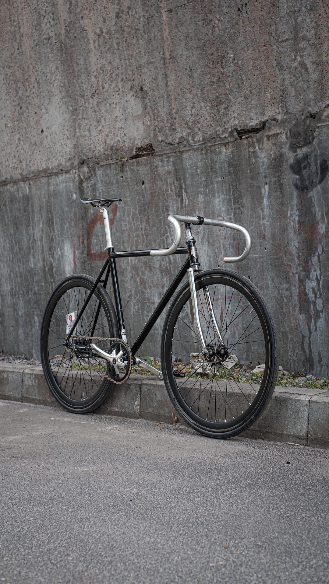 Urban cyclist riding a Pure Fix bicycle through the city.