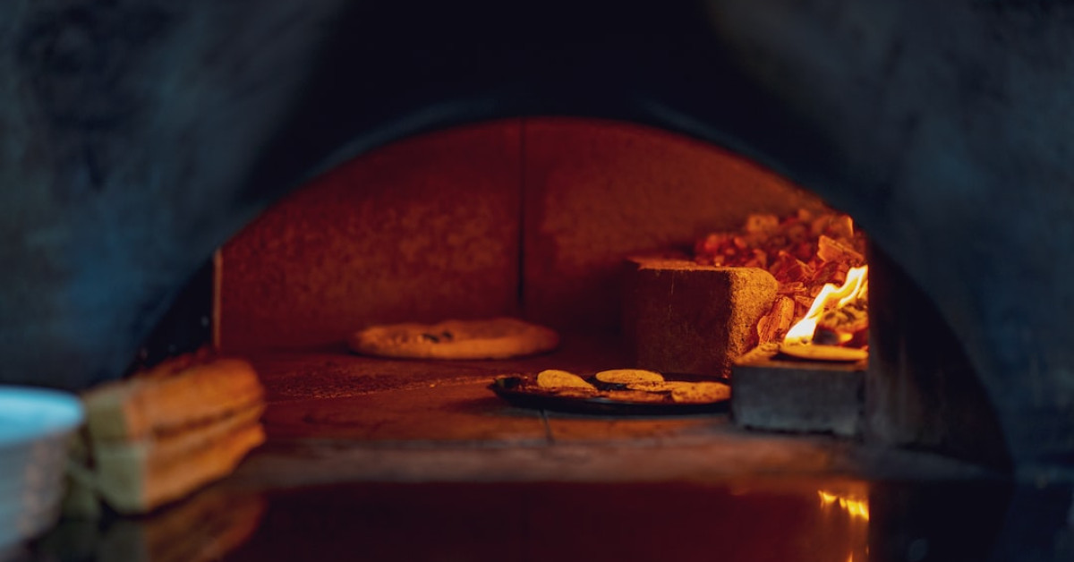 Blackened salmon with fresh garden vegetables on plate.