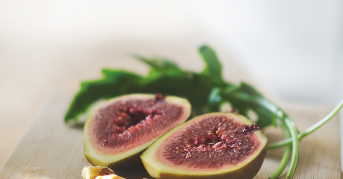 Colorful roasted vegetables on a sheet pan for healthy recipe.