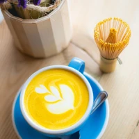 Pumpkin chai latte on table with autumn decoration Pumpkin chai latte on table with autumn decoration