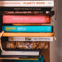 Fresh Campari tomatoes recipe ideas on wooden table. Fresh Campari tomatoes recipe ideas on wooden table.