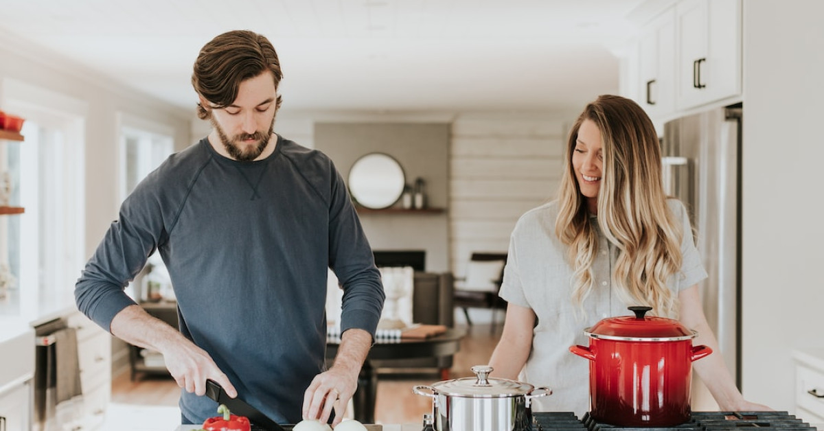 Pork chop Milanese with crispy coating and vegetable sides.