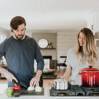 Pork chop Milanese with crispy coating and vegetable sides. Pork chop Milanese with crispy coating and vegetable sides.