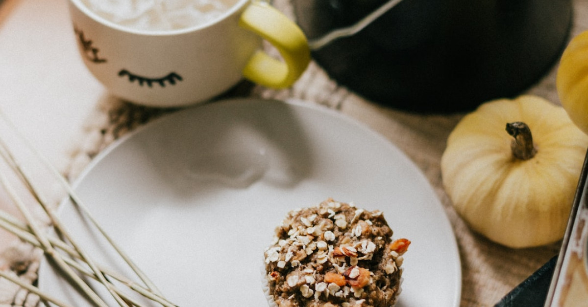 Freshly baked poppy seed muffins on a cooling rack.
