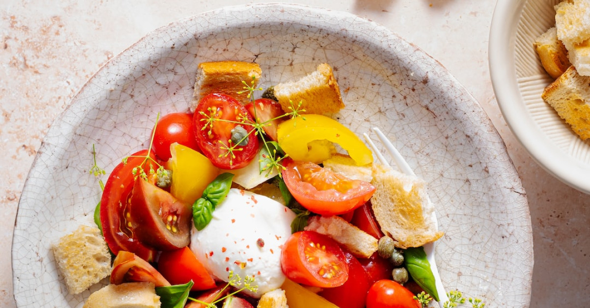 Tasty Taco Salad Bowl with Fresh Ingredients on Table.