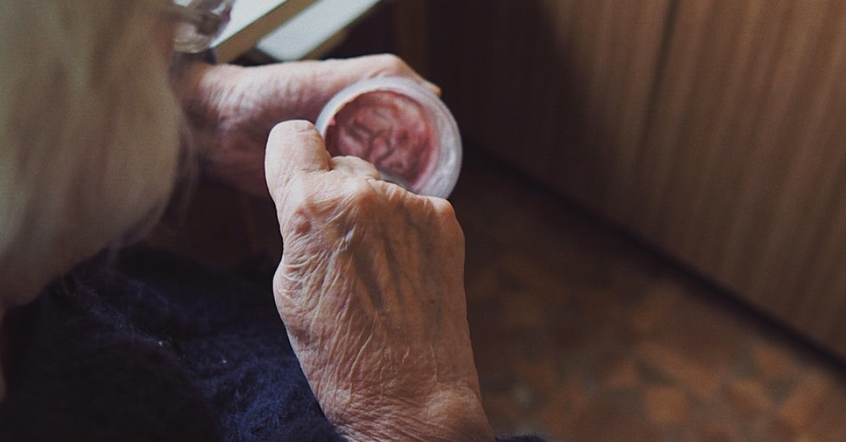 Fresh yogurt-infused naan on wooden board.