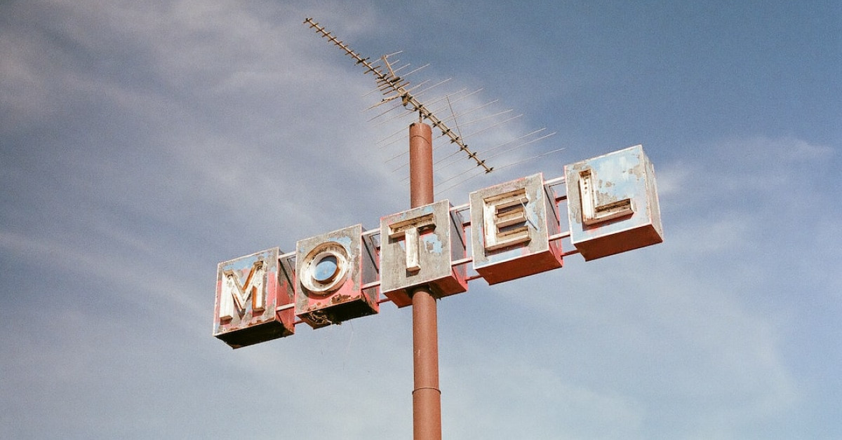 Vintage French onion soup bowls on rustic table setting.