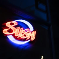 Shrimp sushi bake with colorful veggies on a white plate. Shrimp sushi bake with colorful veggies on a white plate.
