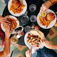 Blackstone Smash Burgers cooking to juicy perfection on grill. Blackstone Smash Burgers cooking to juicy perfection on grill.