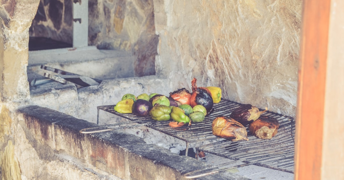 Grilled pork loin and vegetables on barbecue for perfect dinner.
