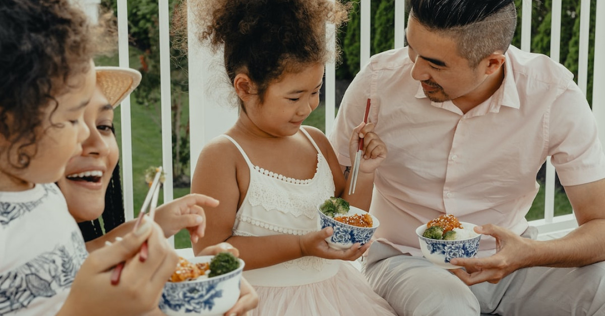 Smashed broccoli with parmesan on white plate.
