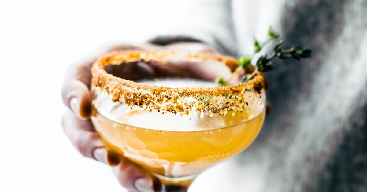 Starburst Energy Drink beside coffee beans and cup.