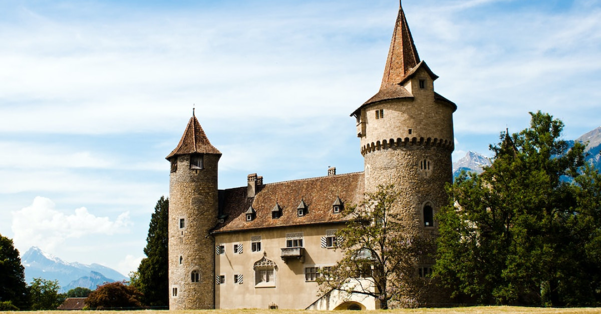 Disney Castle illuminated at night for 25th anniversary celebration.