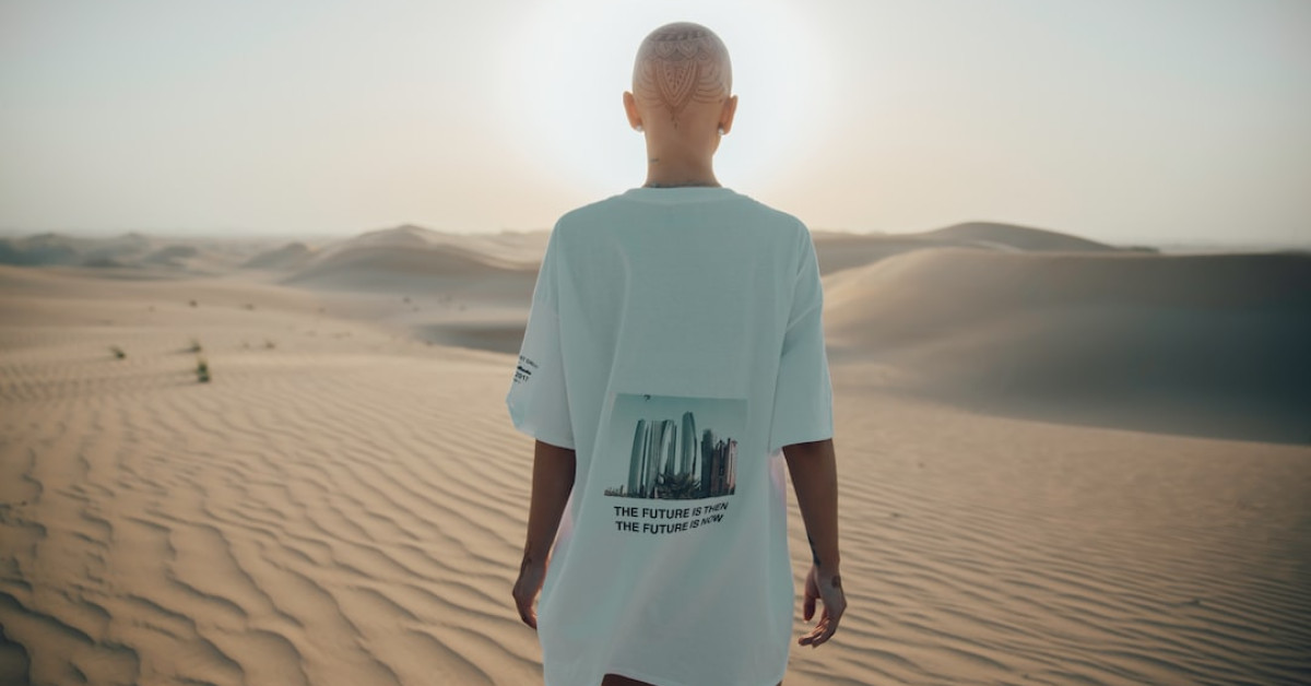 Bald eagle spreading wings in grand flight over natural landscape.
