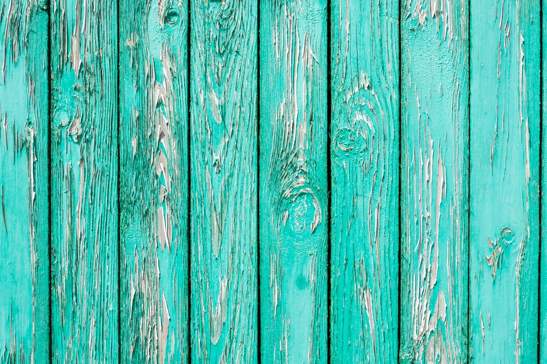 Groom in blue suit with green tie at wedding.