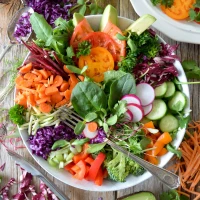 Delicious taco salad bowl with fresh greens and toppings.