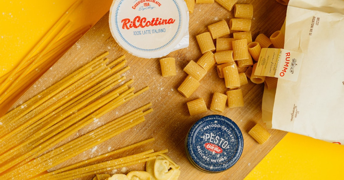 Whipped ricotta topping on colorful vegetable dish.