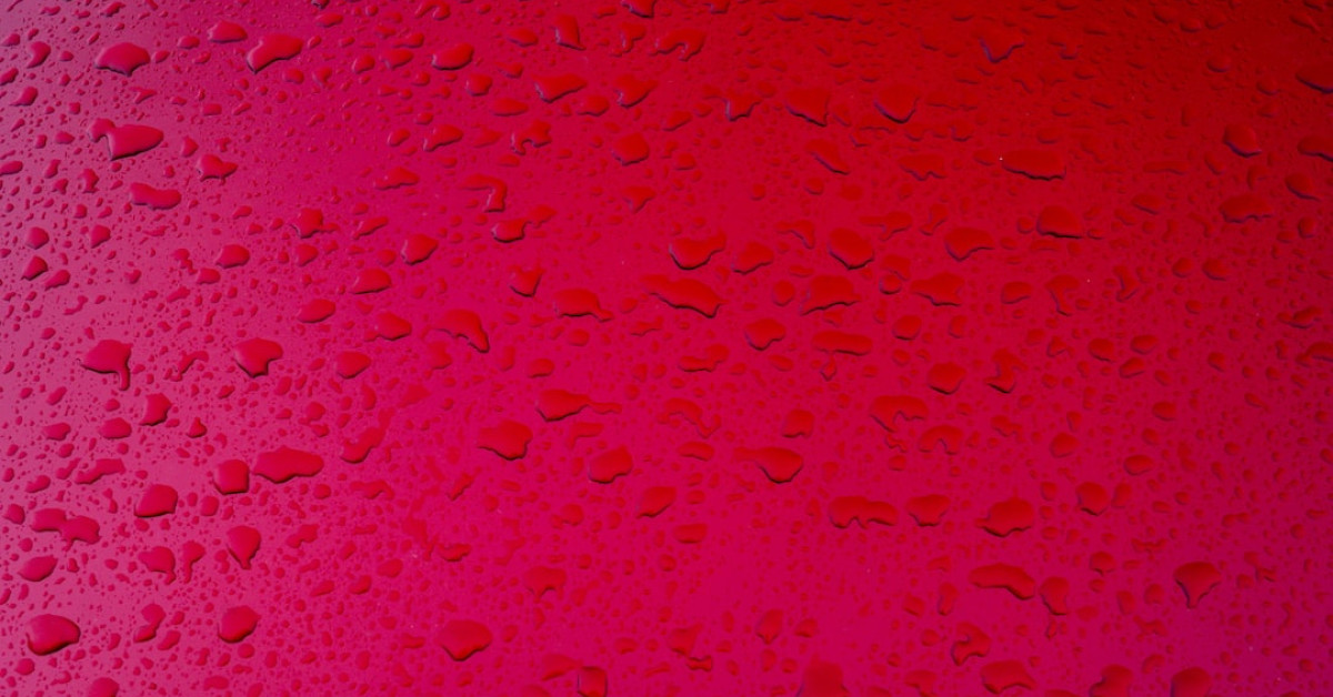 Red Keurig coffee machine ready for brewing morning coffee.