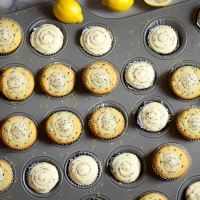 Lemon poppy seed muffins on a cooling rack Lemon poppy seed muffins on a cooling rack