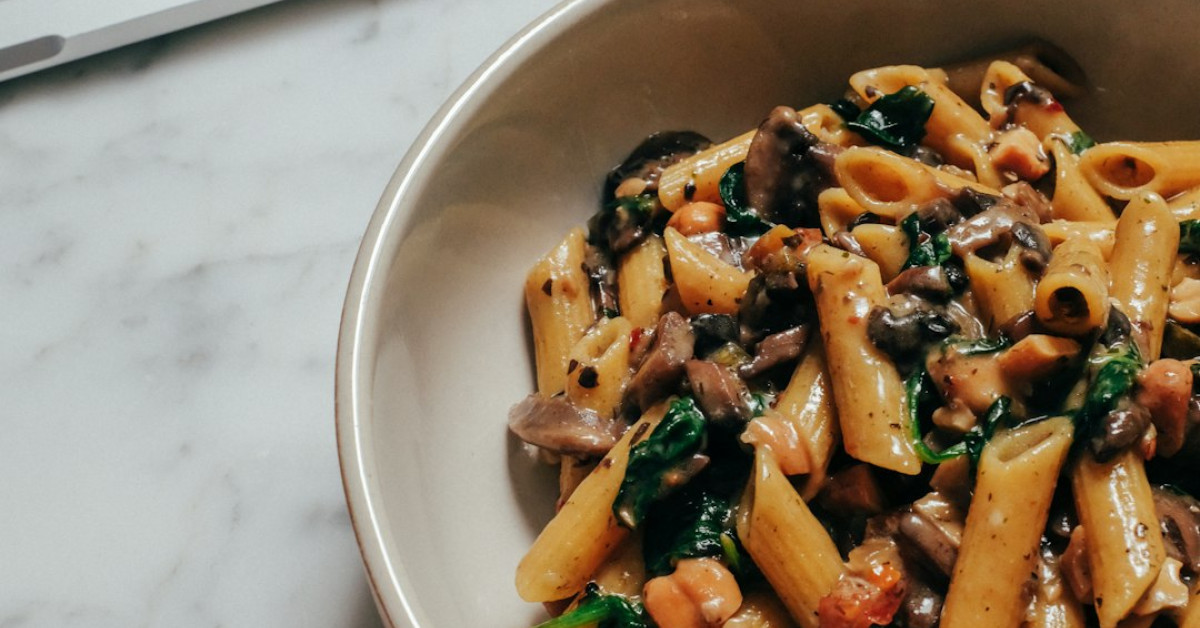 Italian pasta bowls on a vibrant, appetizing table setting.