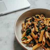 Italian pasta bowls on a vibrant, appetizing table setting. Italian pasta bowls on a vibrant, appetizing table setting.