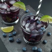 Starbucks high-caffeine drink in a takeaway cup on table. Starbucks high-caffeine drink in a takeaway cup on table.