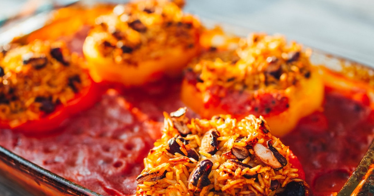 Delicious chicken and rice bowl garnished with fresh herbs.