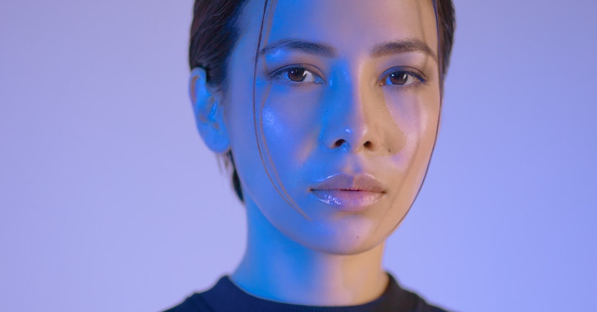 Beginner skydiver experiencing face-first freefall split technique.