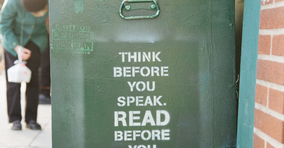 Kiyoshi Kuromiya sharing profound insights at lecture podium.