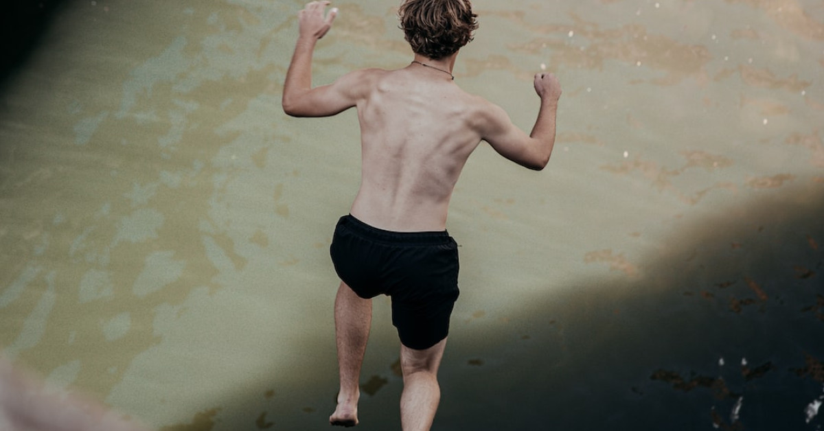 Deep-sea diver examining mysterious Paria wreckage underwater.