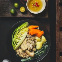 Delicious chicken rice bowl topped with fresh herbs and vegetables. Delicious chicken rice bowl topped with fresh herbs and vegetables.