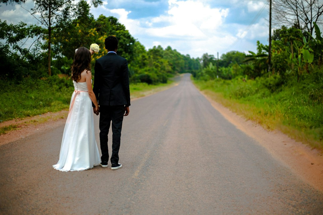 Modern groom in black and green wedding suit