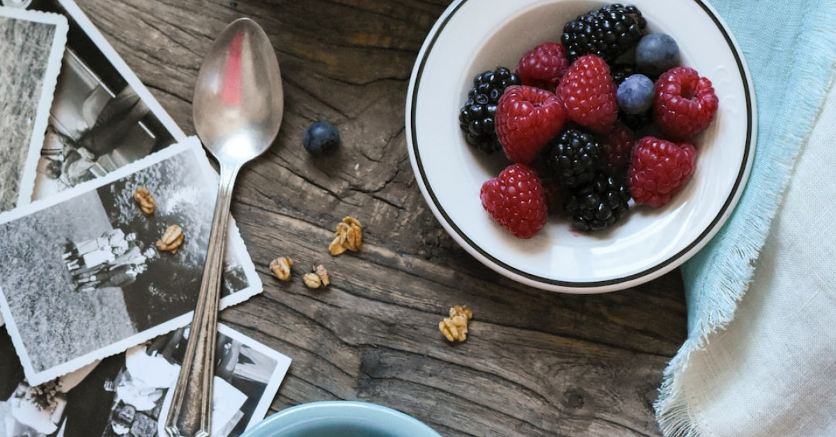 Healthy acai bowl with fresh fruits on wooden table.