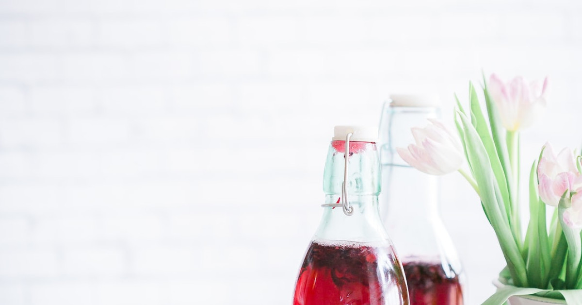 Starbucks Frappuccino bottle caffeine guide on table.