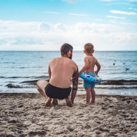 Liam Costner, Kevin Costner's son, smiling in a candid photo. Liam Costner, Kevin Costner's son, smiling in a candid photo.