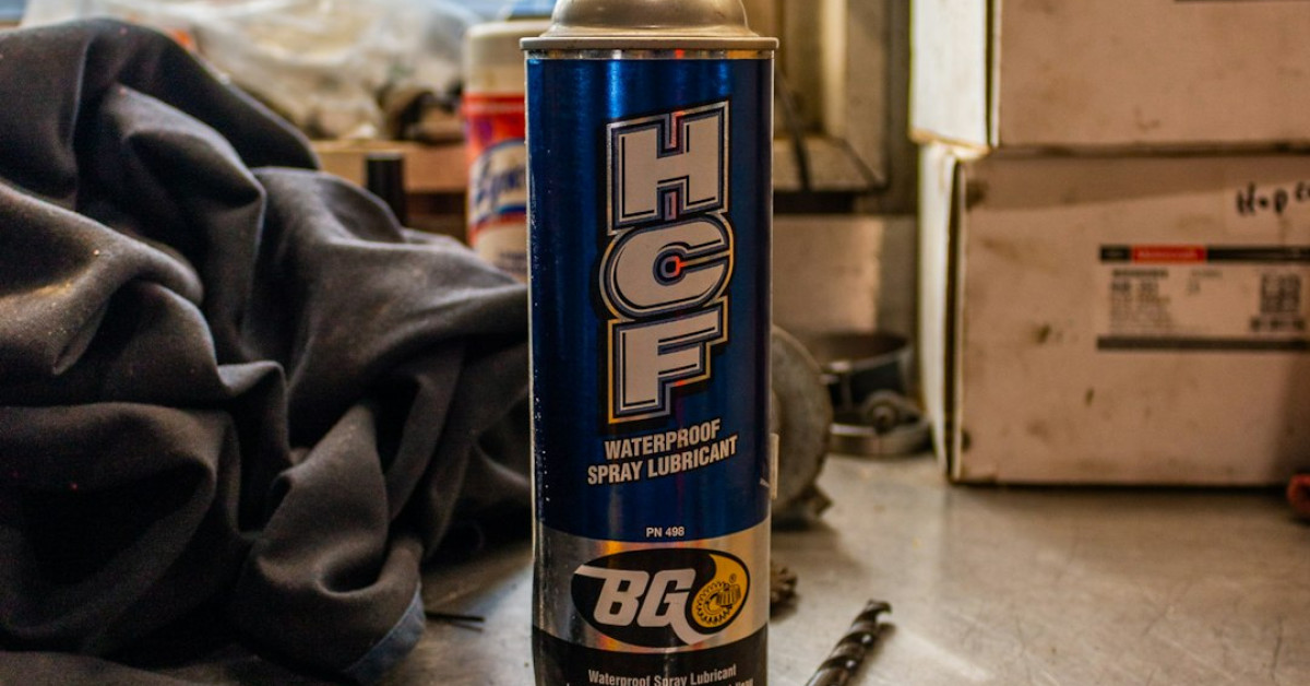 Chicken pecking at strawberries on the ground.